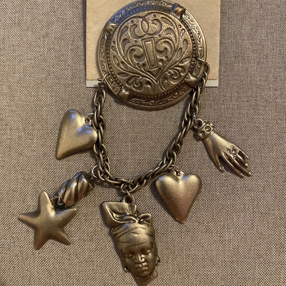 Vintage pin, multiple charms